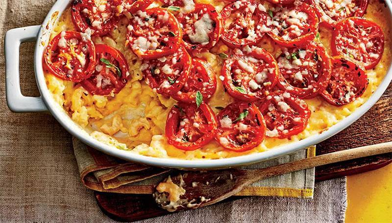 Layered pork casserole with cheese and tomatoes